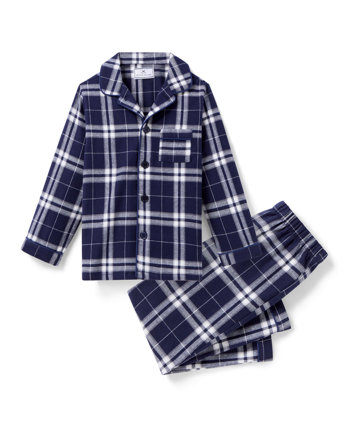 Kid's Brushed Twill Pajama Set in Oxford Tartan, featuring a navy and white plaid long-sleeve button-up top with chest pocket and matching elastic-waist pants, displayed neatly on a white background.