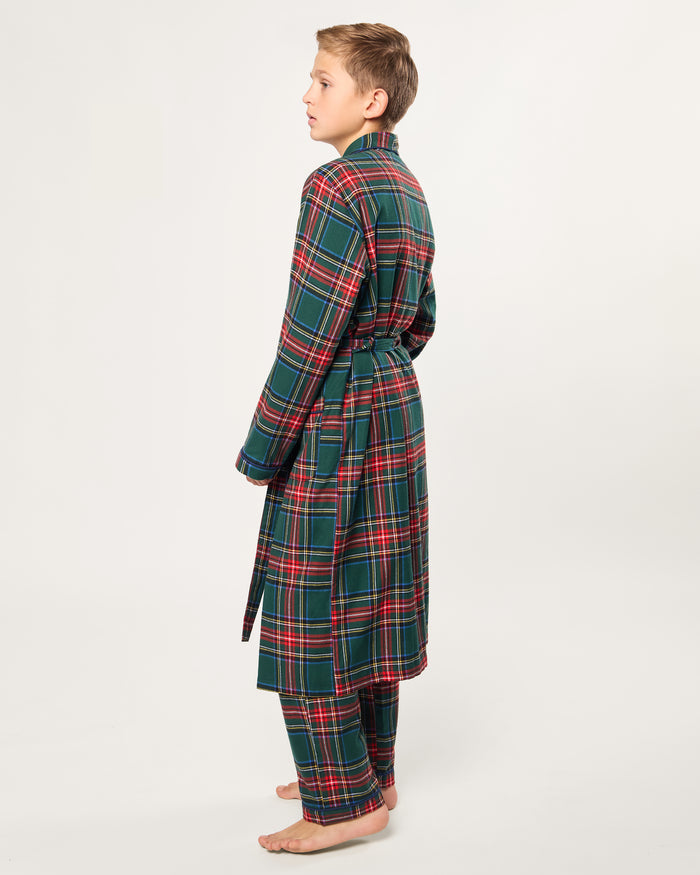 The Kid's Brushed Twill Robe in Kensington Tartan is knee-length with long sleeves, a shawl collar, two front pockets, and a matching belt. It features a classic green, red, and yellow tartan plaid pattern.