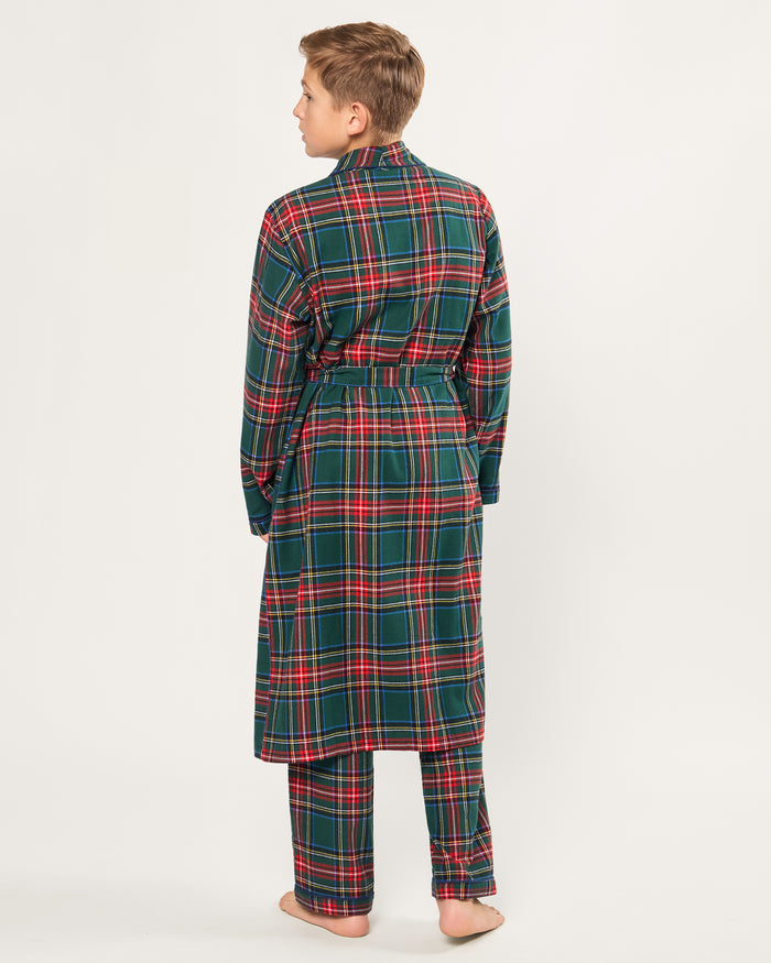 The Kid's Brushed Twill Robe in Kensington Tartan is knee-length with long sleeves, a shawl collar, two front pockets, and a matching belt. It features a classic green, red, and yellow tartan plaid pattern.