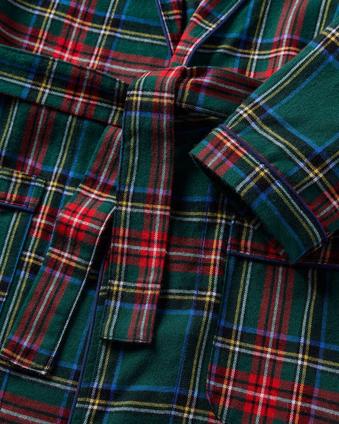The Kid's Brushed Twill Robe in Kensington Tartan is knee-length with long sleeves, a shawl collar, two front pockets, and a matching belt. It features a classic green, red, and yellow tartan plaid pattern.