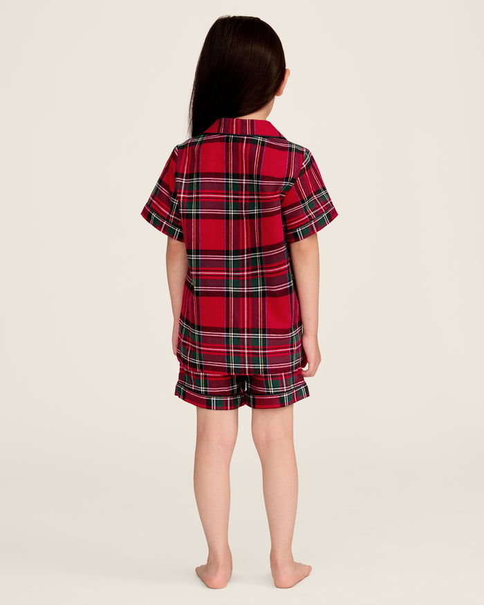 The Kid's Brushed Twill Short Set in Imperial Tartan features red plaid with green, black, and white stripes, including a short-sleeve button-up shirt with a chest pocket and matching elastic waistband shorts.