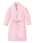 The Petite Plume Kids Flannel Robe in Pink is a chemical-free, cozy sleepwear option featuring long sleeves, a shawl collar, two front pockets, and a matching waist belt. Its perfect for kids and displayed against a plain white background.
