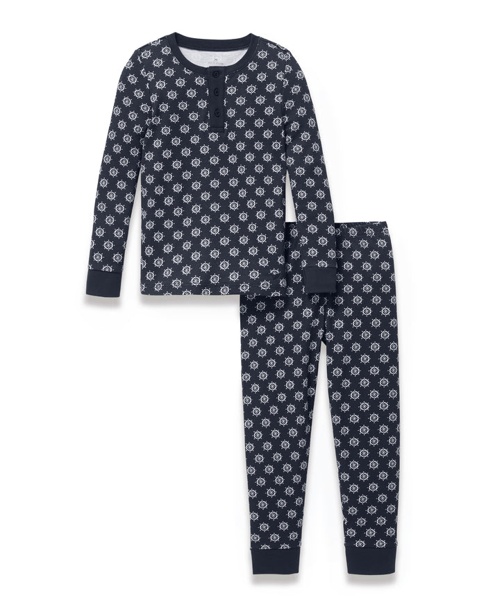 Kid’s Pima Snug Fit Pajama Set in Captain’s Compass, featuring long sleeves and matching pants in navy blue with white circular geometric patterns and a buttoned collar, displayed on a white background.