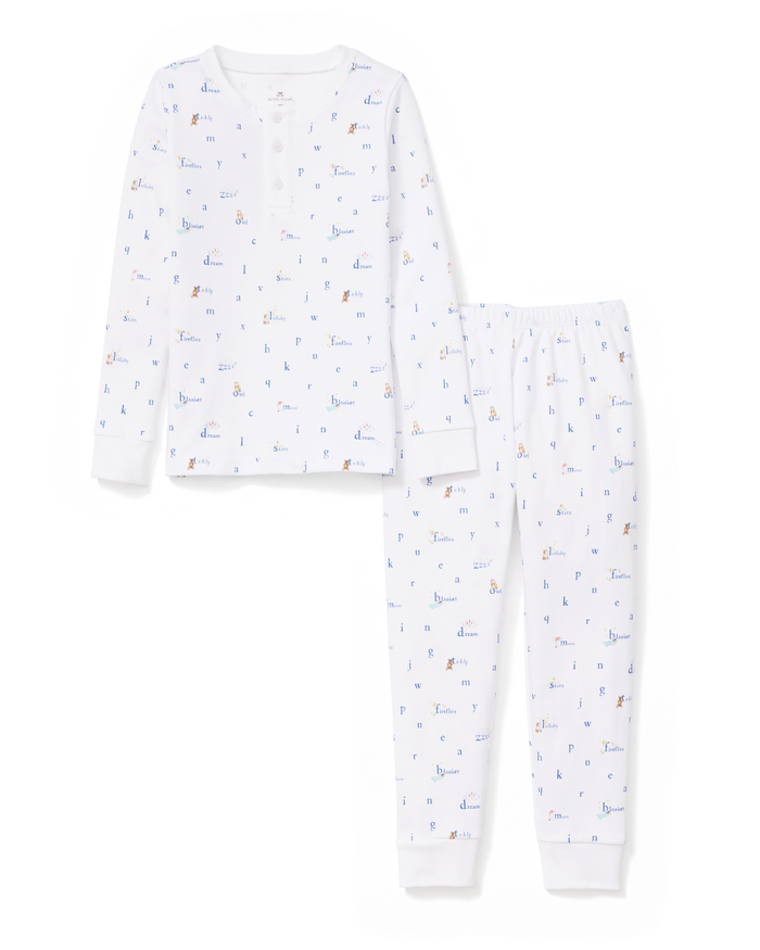 Kid’s Pima Snug Fit Pajama Set in Letters and Lullabies: a two-piece pajama set for children, featuring a white long-sleeve top and matching pants adorned with a playful, colorful alphabet and animal print pattern.