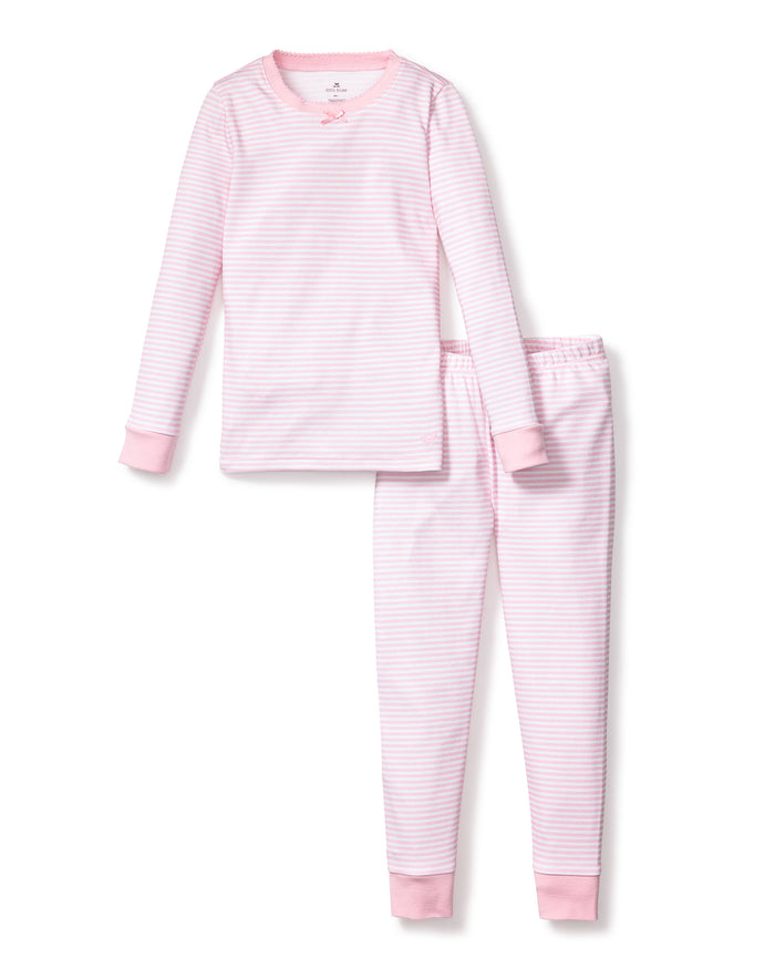 The Kids Pima Snug Fit Pajama Set by Petite Plume features pink and white stripes in soft Pima cotton. It includes a cozy long-sleeve top with a cute bow at the neckline and matching pants with charming pink cuffs, showcased on a white background.