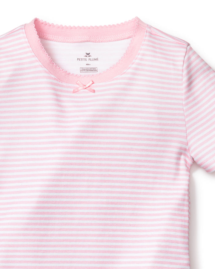 The Petite Plume Kids Pima Snug Fit Pajama Short Set in Pink Stripes features a luxurious Pima cotton top with pink and white stripes, a small decorative bow at the neckline, and a charming scalloped collar.