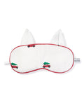 The Kids Twill Kitty Sleep Mask in Holiday Journey by Petite Plume features a whimsical design with red cars carrying Christmas trees, ear-like extensions, and festive red trim. A PETITE tag on the side adds charm, making it an ideal holiday gift for your sleepwear collection.