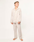 Kid's Twill Pajama Set in Camel Gingham features long sleeves, pants with an elastic waistband, and a button-up shirt with a collar and front pocket, all in a beige and white gingham check pattern.