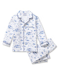 Kid's Twill Pajama Set in Chalet Toile, a white pajama set with blue piping and scenic print, includes a long-sleeve button-up top and matching pants, shown laid flat on a white background.