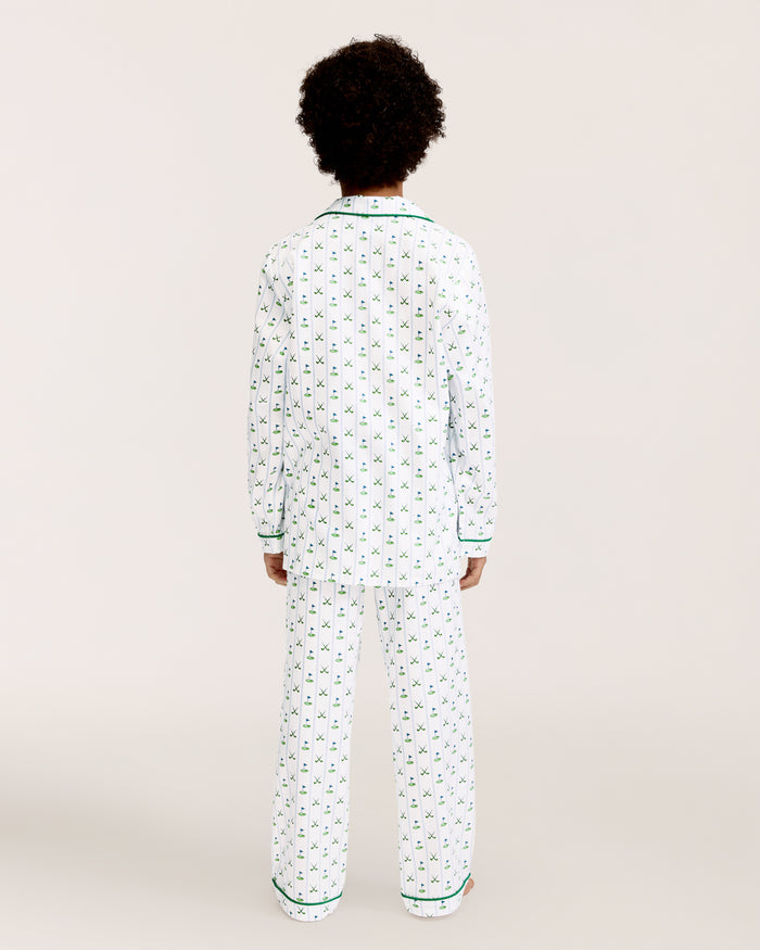 The Kid's Twill Pajama Set in Fairway Stripe features white pajamas with green piping, a tennis racket and green stripe pattern, a long-sleeve button-up top with a chest pocket, and matching long pants.
