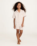The Kid's Twill Pajama Short Set in Camel Gingham features a light beige and white gingham pattern with a collared, button-front top, chest pocket, and elastic waist shorts.