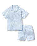 The Kid's Twill Pajama Short Set in Light Blue Gingham features a button-up short-sleeve top with a chest pocket and matching elastic-waist shorts in a classic gingham check pattern.