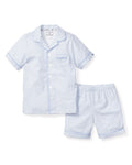 Explore the Kids Twill Pajama Short Set in La Mer by Petite Plume: a light blue patterned short-sleeve set made from premium cotton, featuring a button-up top with a collar and chest pocket, plus matching elastic waistband shorts for comfort and style.