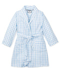 The Kid's Twill Robe in Light Blue Gingham features a soft gingham pattern, long sleeves, shawl collar, front pockets, and a matching belt at the waist for comfort and style.
