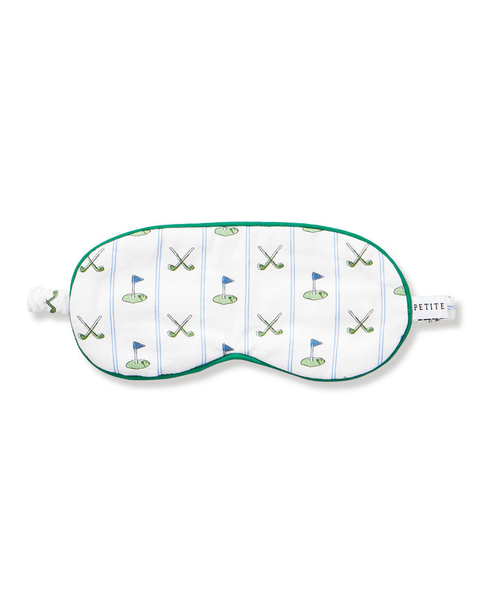 The Kid's Twill Sleep Mask in Fairway Stripe features a white design with green trim, decorated with golf clubs and flags. It includes an adjustable strap and a PETITE tag.