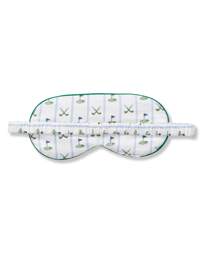 The Kid's Twill Sleep Mask in Fairway Stripe features a white design with green trim, decorated with golf clubs and flags. It includes an adjustable strap and a PETITE tag.