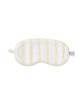 The Kids Twill Sleep Mask in Sunny Stripe by Petite Plume is a white eye mask with sunny stripes and a PETITE side label, offering full coverage for soft, comfortable sleep.