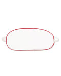 White oval-shaped kid’s twill sleep mask with red piping and two straps, laid flat against a white background.