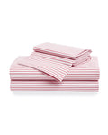 A neatly arranged stack of Petite Plume’s Luxe Premium 100% cotton bed sheets in an antique red ticking pattern features varied percale sheet sizes displaying stripes in diverse orientations against a plain white background.