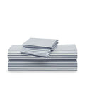 A stack of neatly folded Luxe Premium Cotton Bed Sheets in Navy French Ticking by Petite Plume is seen. Crafted from 100% cotton percale, the set includes a flat sheet, fitted sheet, and two pillowcases.
