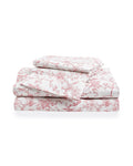 A neatly stacked set of Luxe Premium Percale Bed Sheets in Pink Timeless Toile, featuring two folded sheets and two pillowcases, displayed on a white background.