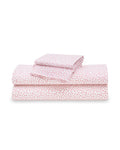Petite Plumes Luxe Premium Cotton Sweethearts Bed Sheets, featuring a pink heart pattern on white, include a fitted sheet, flat sheet, and two pillowcases, all neatly arranged for a touch of luxury.