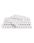 A stack of Luxe Premium Percale Bed Sheets in Teddy Tales, white and neatly folded, showcases a charming repeating pattern of small brown teddy bears.