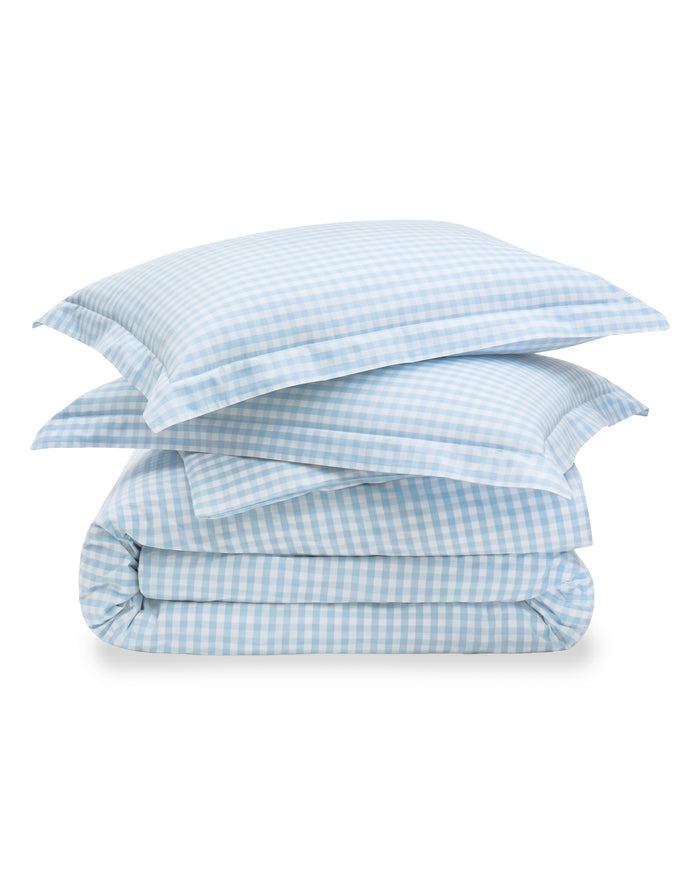 Blue and white checkered bedding set on a white background