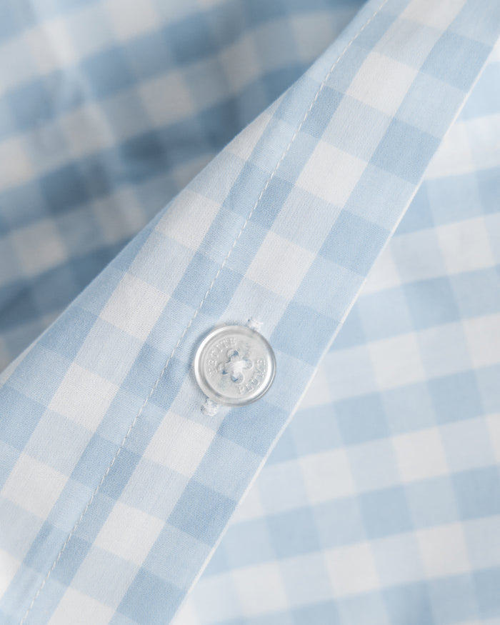 Blue and white checkered bedding set on a white background