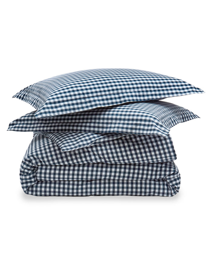 Blue and white checkered bedding set on a white background