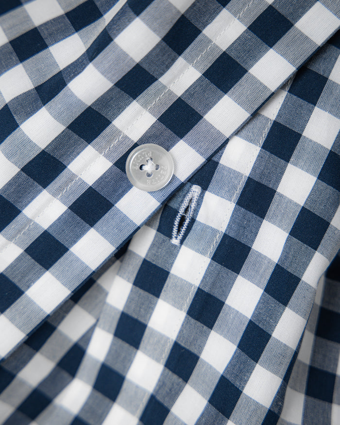 Blue and white checkered bedding set on a white background