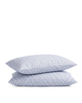 Two stacked Luxe Premium Percale Pillow Cases in Ditsy Waltz White, featuring a small, scattered blue floral pattern on crisp white fabric, displayed against a plain white background.