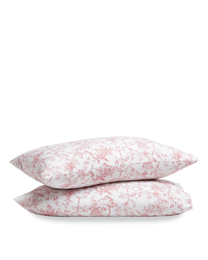 Two Luxe Premium Percale Pillow Cases in Pink Timeless Toile, featuring a pink floral toile pattern, stacked against a white background.