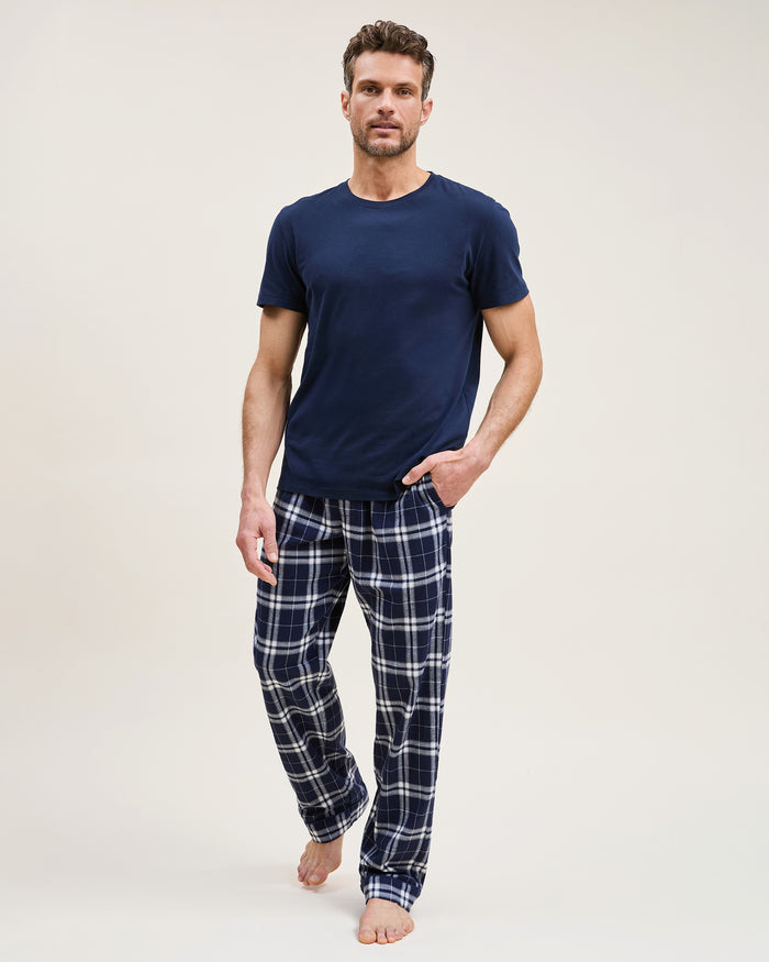 Men's Brushed Twill Pajama Pant in Oxford Tartan featuring navy blue and white plaid, an elastic waistband, and a drawstring, shown laid flat on a white background.
