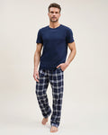 Men's Brushed Twill Pajama Pant in Oxford Tartan featuring navy blue and white plaid, an elastic waistband, and a drawstring, shown laid flat on a white background.