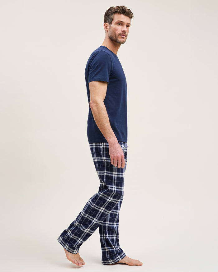 Men's Brushed Twill Pajama Pant in Oxford Tartan featuring navy blue and white plaid, an elastic waistband, and a drawstring, shown laid flat on a white background.