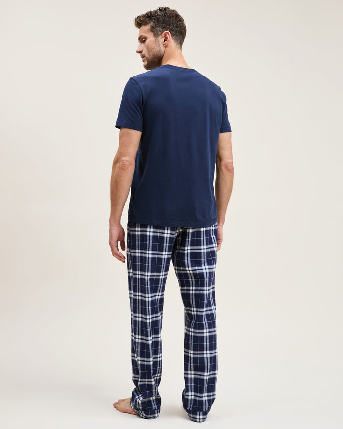 Men's Brushed Twill Pajama Pant in Oxford Tartan featuring navy blue and white plaid, an elastic waistband, and a drawstring, shown laid flat on a white background.
