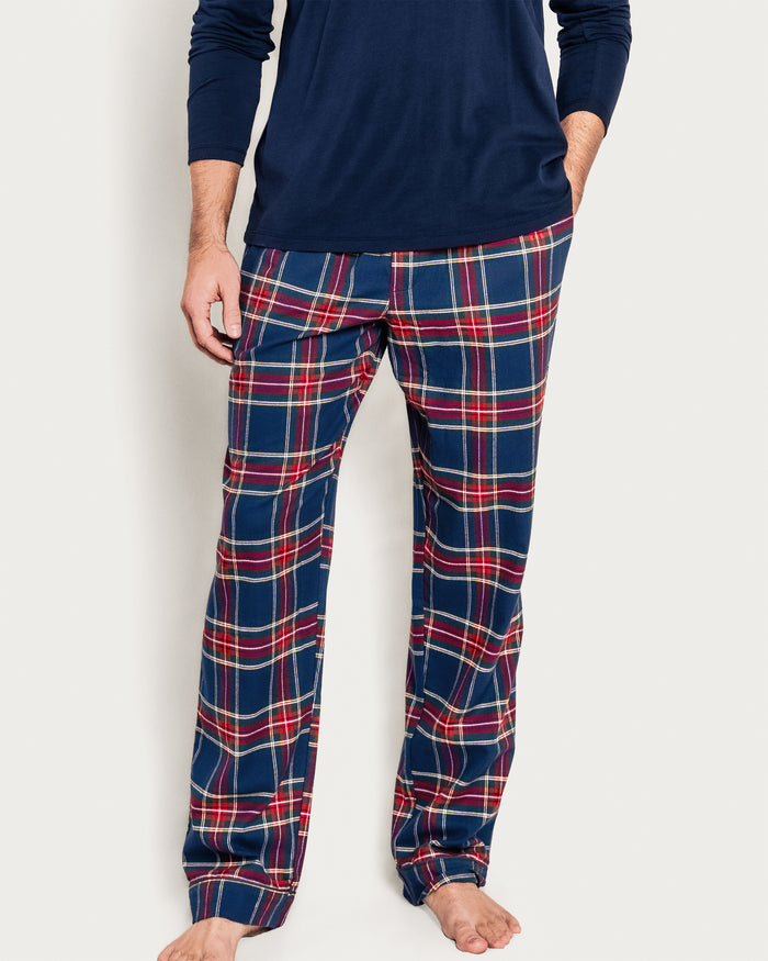 The Men's Brushed Twill Pajama Pant in Windsor Tartan features a navy base with red, green, and yellow stripes, plus an elastic waistband and drawstring tie for comfort.
