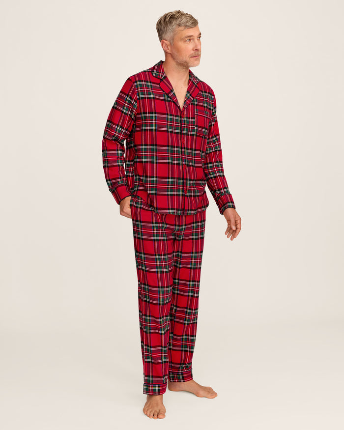 The Men's Brushed Twill Pajama Set in Imperial Tartan features a red plaid design with green, white, and black stripes, a button-up long-sleeve top with a chest pocket, and matching pants, displayed neatly on a white background.