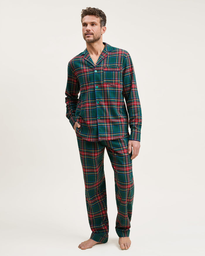 The Men's Brushed Twill Pajama Set in Kensington Tartan features a button-up long-sleeve shirt and matching drawstring pants in a classic green, red, yellow, and blue plaid pattern.