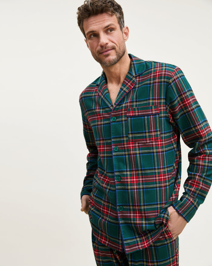 The Men's Brushed Twill Pajama Set in Kensington Tartan features a button-up long-sleeve shirt and matching drawstring pants in a classic green, red, yellow, and blue plaid pattern.