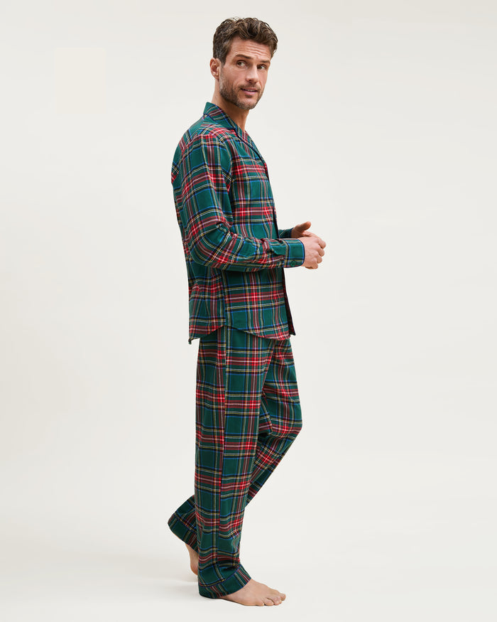 The Men's Brushed Twill Pajama Set in Kensington Tartan features a button-up long-sleeve shirt and matching drawstring pants in a classic green, red, yellow, and blue plaid pattern.