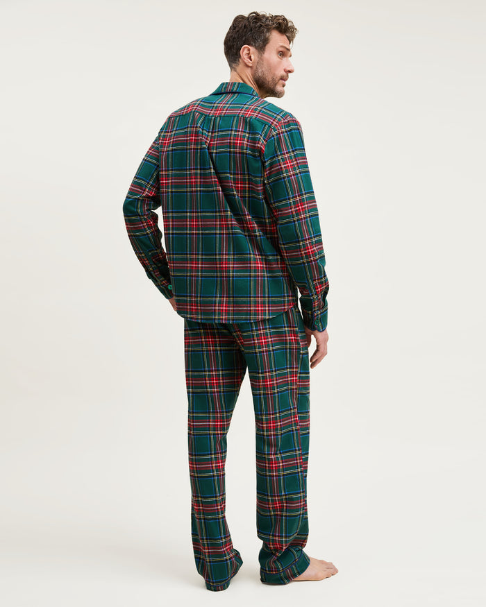 The Men's Brushed Twill Pajama Set in Kensington Tartan features a button-up long-sleeve shirt and matching drawstring pants in a classic green, red, yellow, and blue plaid pattern.