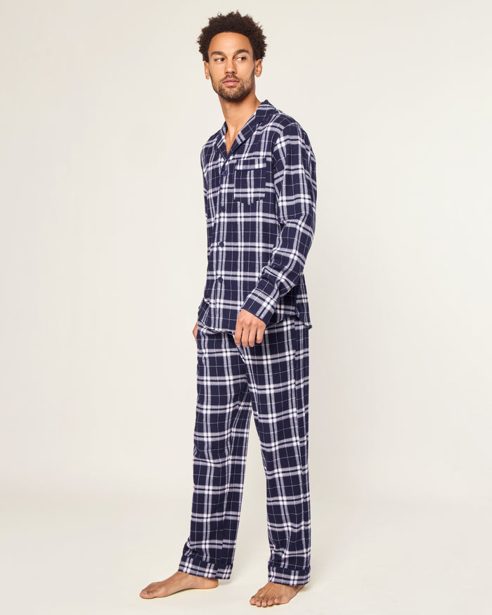 The Men's Brushed Twill Pajama Set in Oxford Tartan includes a two-piece navy and white plaid design with a long-sleeved button-up shirt featuring a chest pocket and matching drawstring pants.