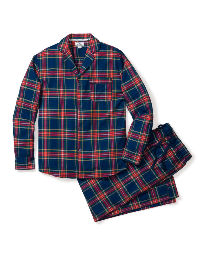 Close-up of a lightweight flannel plaid fabric with red, green, blue, and yellow stripes. The pattern is from Petite Plumes Mens Brushed Cotton Pajama Set in Windsor Tartan, featuring a notched lapel and a single black button.