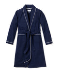 The Petite Plume Mens Flannel Robe, navy with white piping, features two front pockets and a waist belt, displayed against a plain white background.