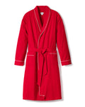 The Mens Flannel Robe by Petite Plume is a luxurious red bathrobe with white piping, featuring a shawl collar, waist tie, and two front pockets. The robe is showcased on a plain white background.