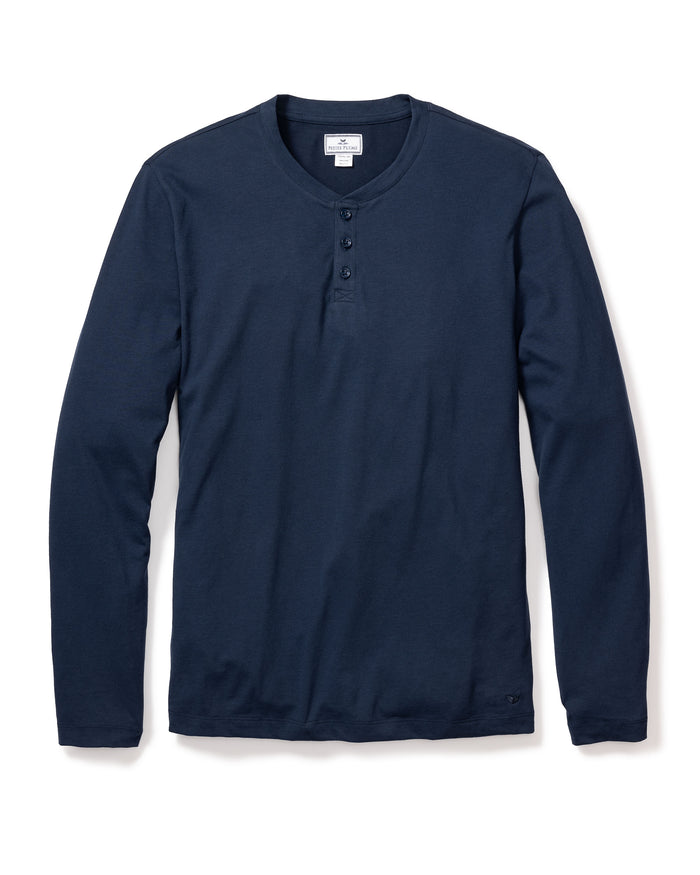 The Mens Pima Henley in Navy by Petite Plume features a soft Peruvian Pima cotton fabric and a classic three-button placket. Its simple design makes it an ideal addition to your bedtime routine, displayed on a white background for clarity.