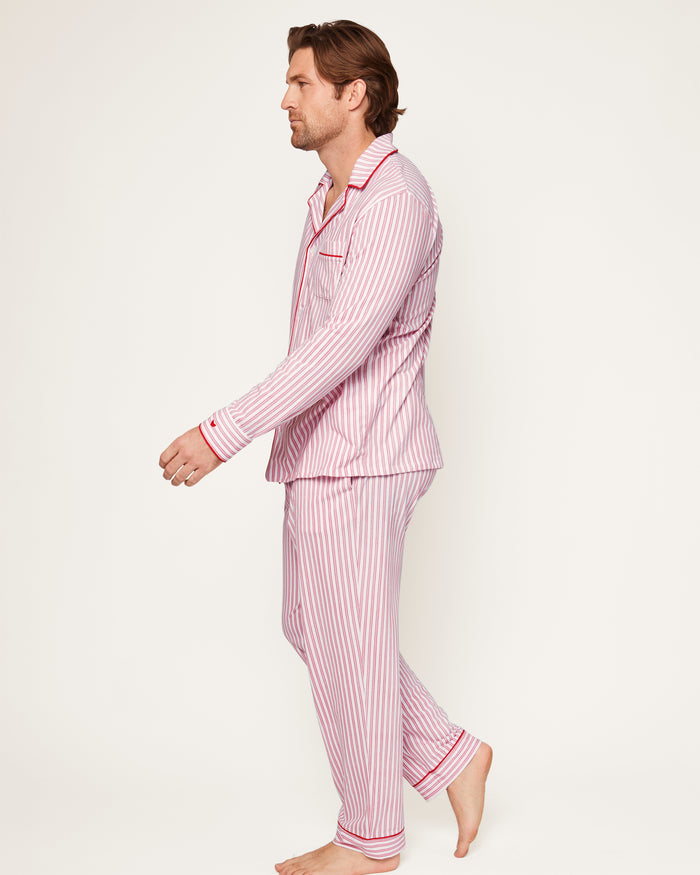This close-up features the Mens Pima Pajama Top by Petite Plume in Antique Red Ticking. The luxurious yarn-dyed Peruvian Pima cotton showcases vertical red and white stripes with a visible button and pocket outlined in red piping, ensuring softness and comfort for restful nights.