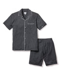 The Mens Pima Pajama Short Set in Dark Heather Grey by Petite Plume is made from soft jersey knit. It features a short-sleeve button-up top with a chest pocket and white piping, paired with shorts that have an elastic waistband for comfort, crafted from quality yarn-dyed fabric.